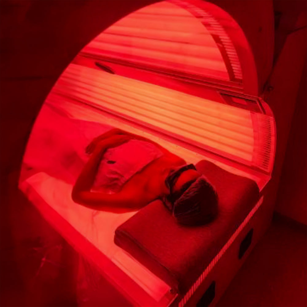 Full Spectrum Therapy Pod with person and it turned on