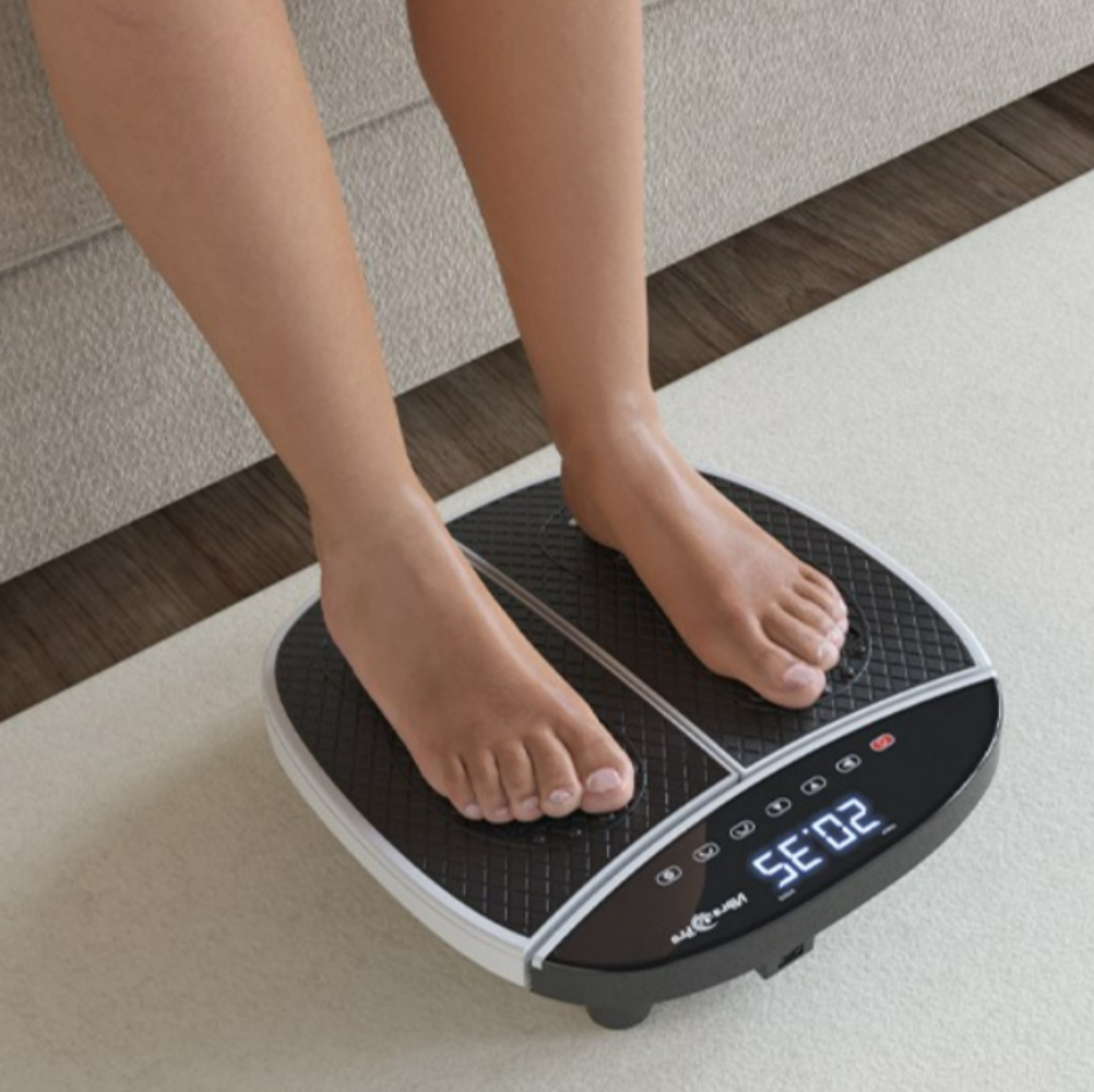 Feet on VibraPro Slim Rexflexology M1 Vibration Exercise Machine