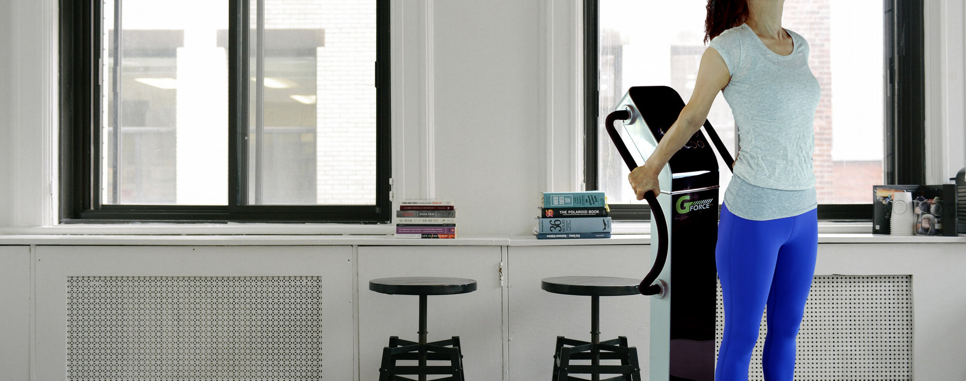 Woman standing on GForce Professional Whole Body Vibration Machine