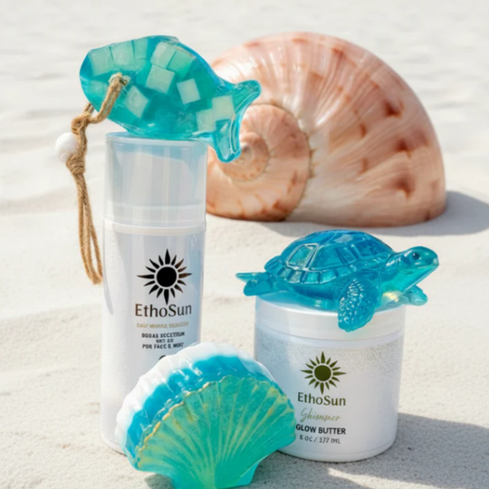 EthoSun skincare products with turtle and shell designs on a sandy background
