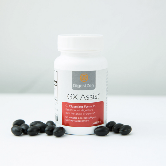 Supplement bottle labeled 'GX Assist' with black capsules on a white  background