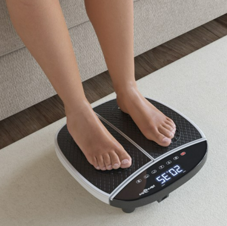 Feet on VibraPro Slim Rexflexology M1 Vibration Exercise Machine